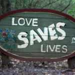 photo of sign with text love saves lives